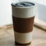 Custom ceramic double wall insulated travel coffee cup with slider lid, silicone sleeve & built-in coaster