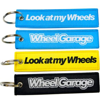 Promotional wholesale custom brand name travel souvenir woven embroidery logo fabric keychains